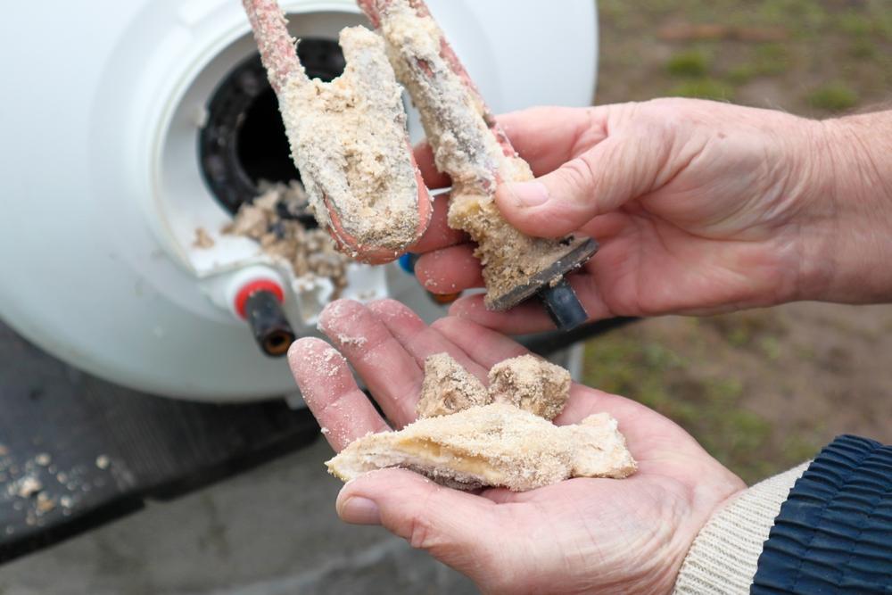 lime,deposits,on,stainless,steel,heating,element,and,anode.,replacement